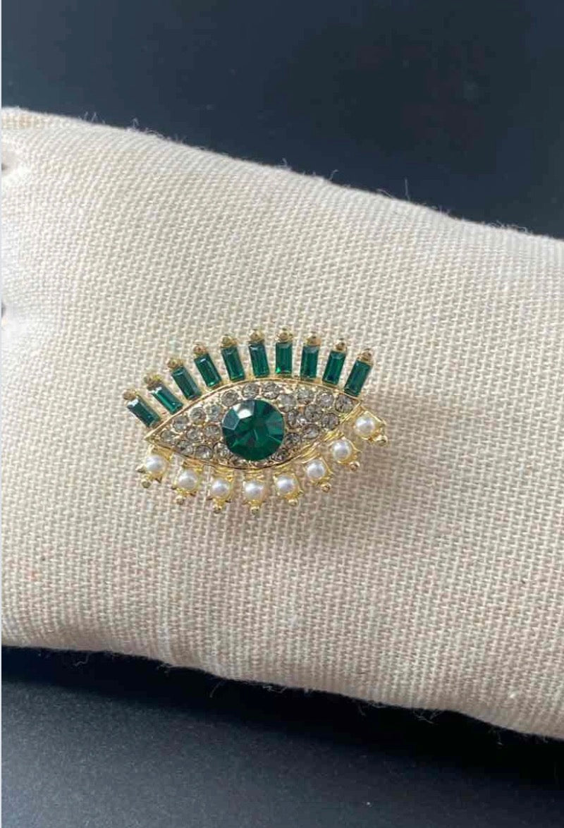 Broche œil protecteur